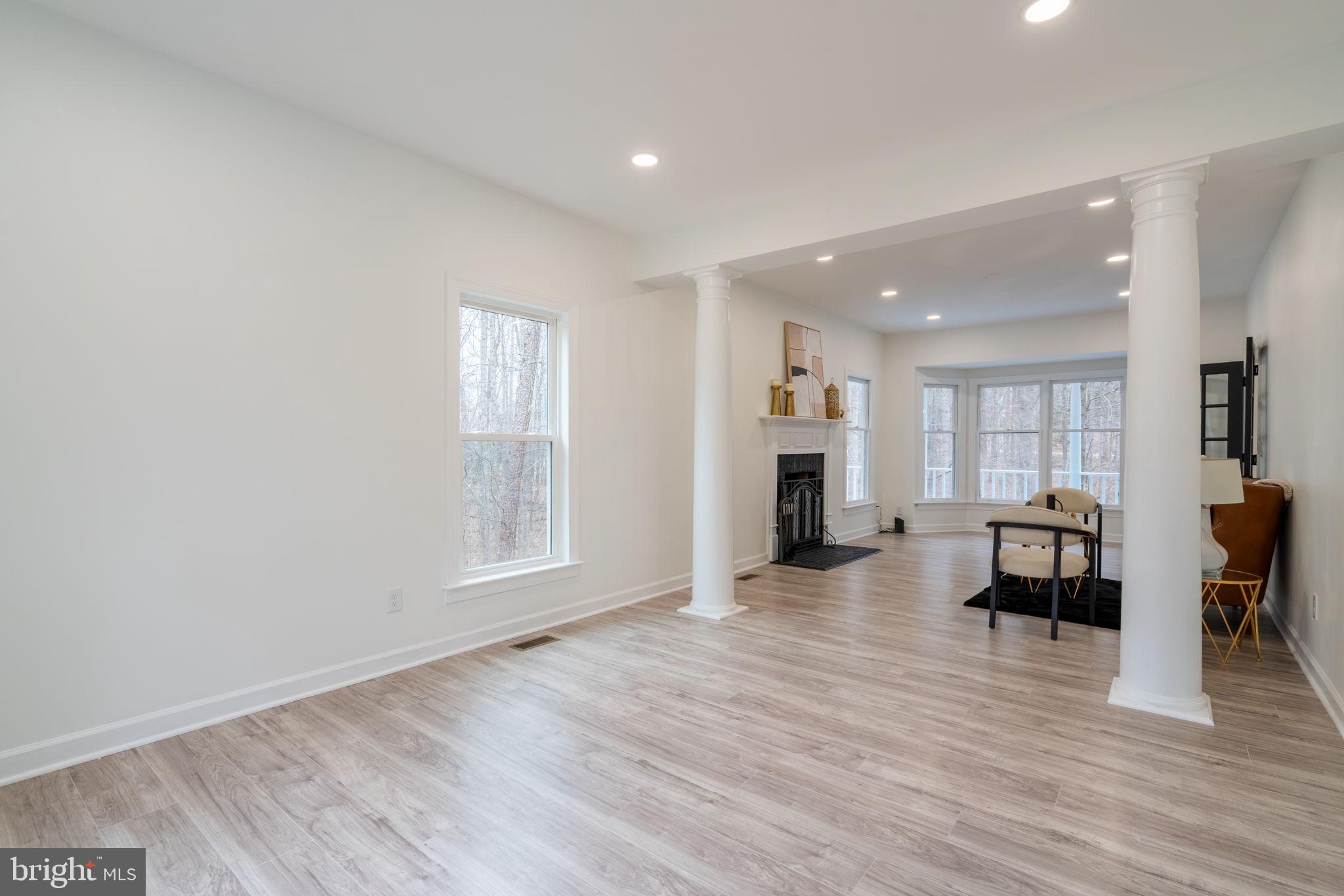 8261 Tinsley Place Culpeper, VA 22701 - Photo 32 of 80 a view of empty room with wooden floor and furniture