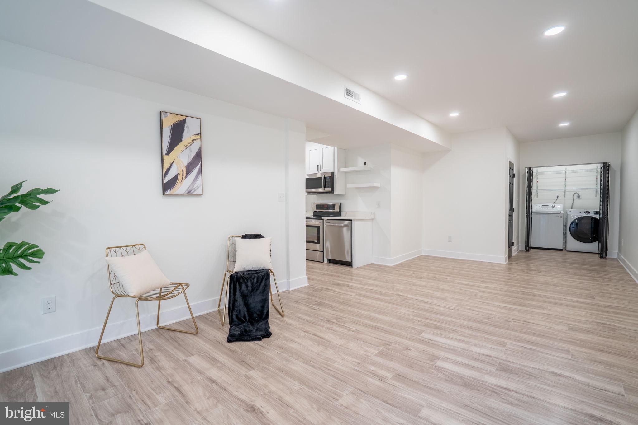 8261 Tinsley Place Culpeper, VA 22701 - Photo 57 of 80 a view of empty room with furniture and wooden floor