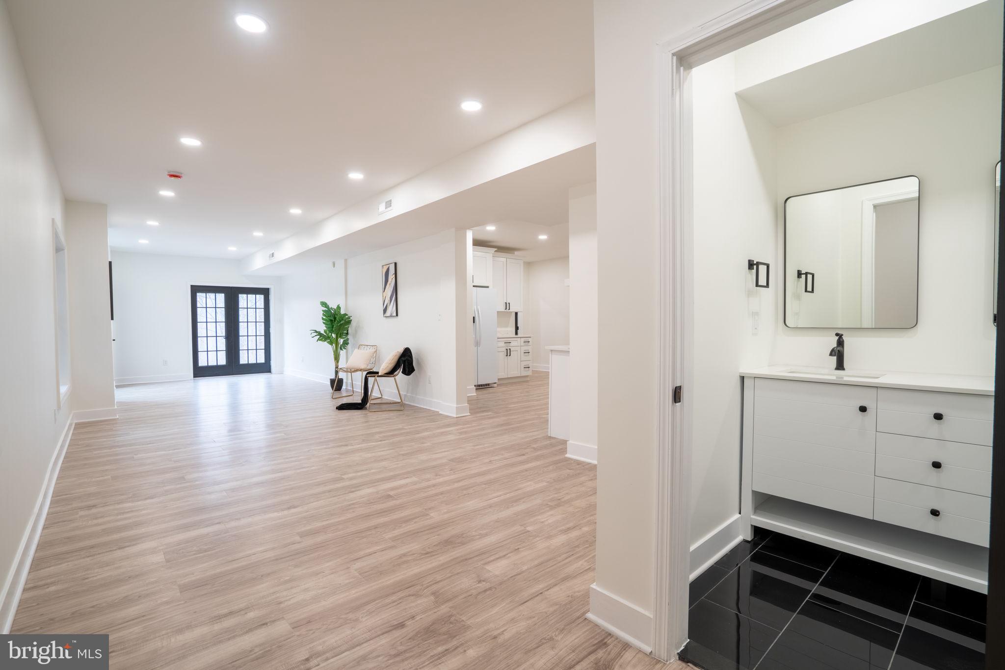 8261 Tinsley Place Culpeper, VA 22701 - Photo 65 of 80 a view of a hallway with wooden floor