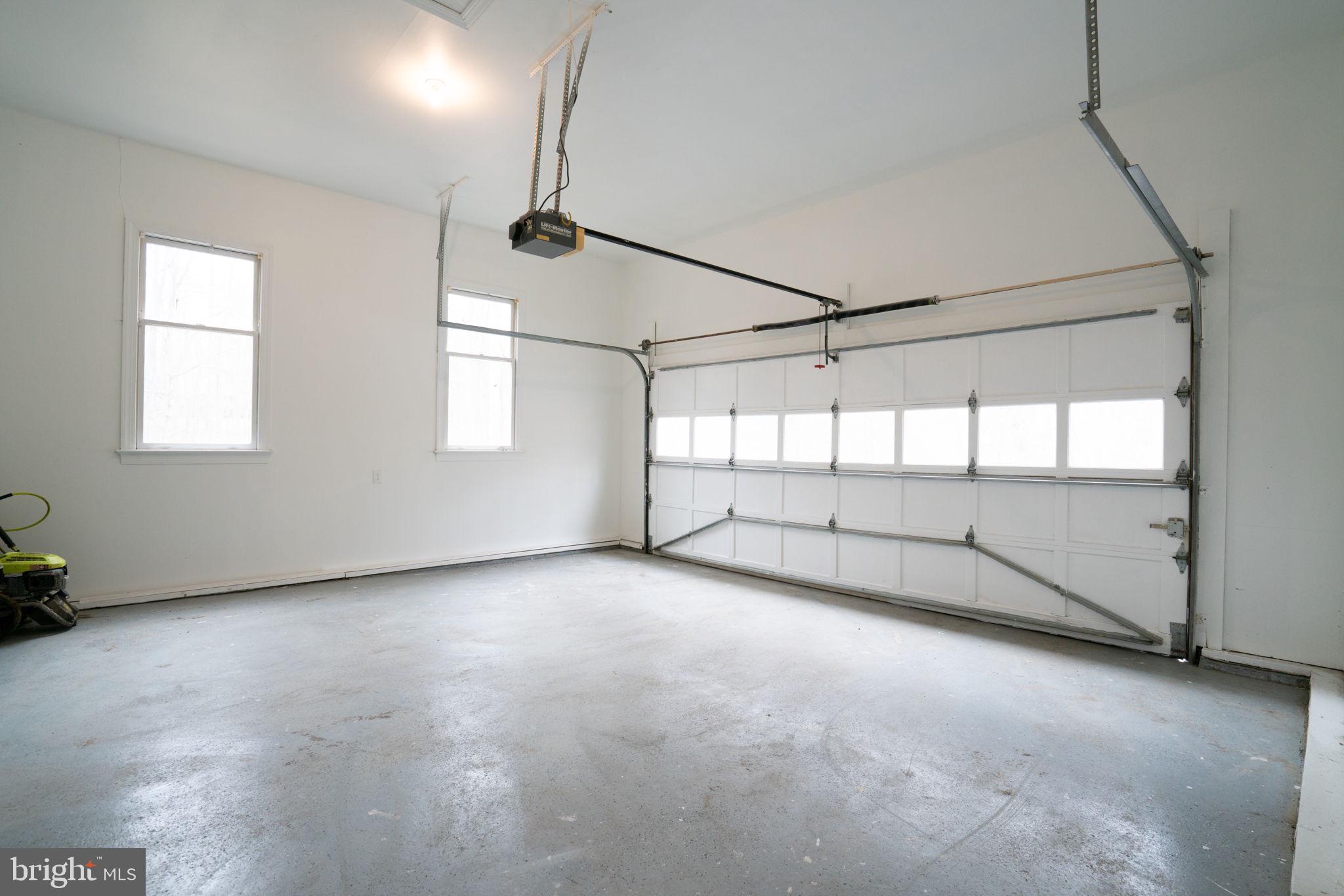 8261 Tinsley Place Culpeper, VA 22701 - Photo 66 of 80 a view of a room with window and a ceiling fan