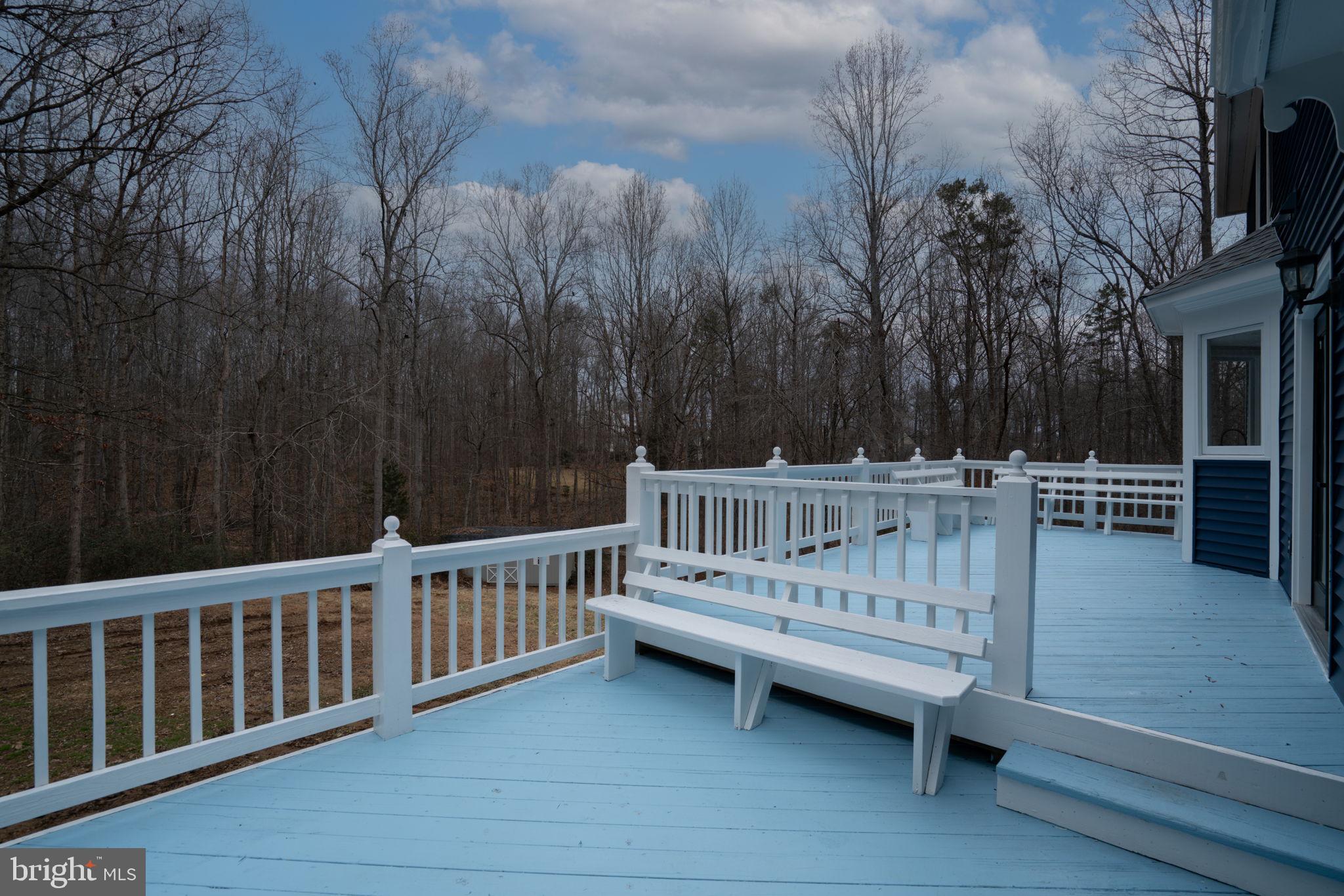 8261 Tinsley Place Culpeper, VA 22701 - Photo 67 of 80 a view of balcony with wooden fence and trees