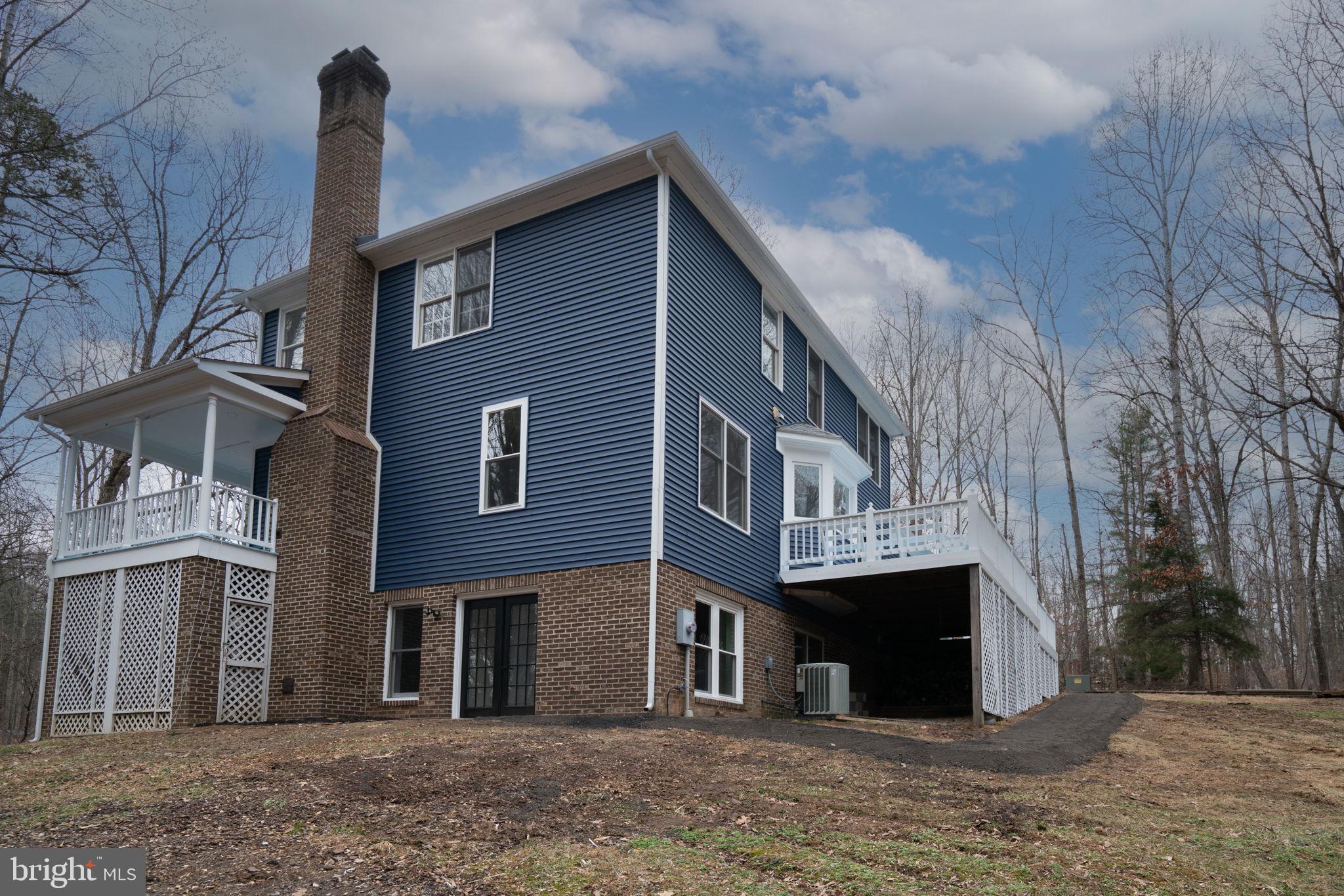 8261 Tinsley Place Culpeper, VA 22701 - Photo 74 of 80 a front view of a house with a yard