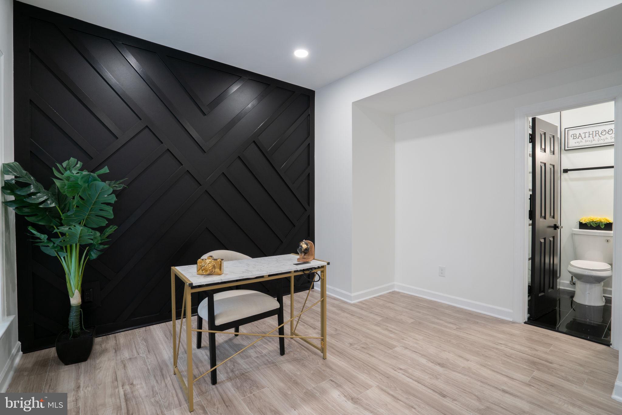 8261 Tinsley Place Culpeper, VA 22701 - Photo 9 of 80 a room with furniture and a potted plant