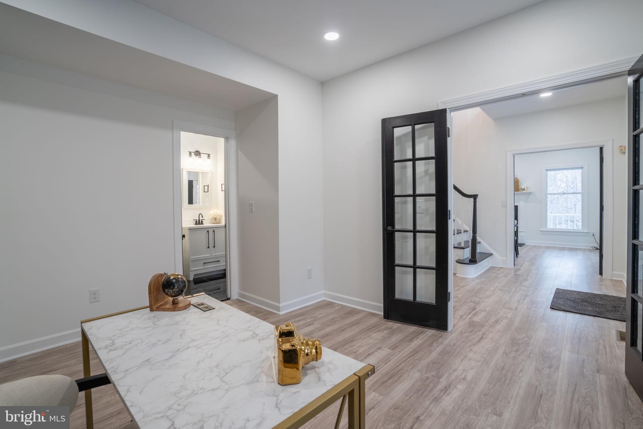 8261 Tinsley Place Culpeper, VA 22701 - Photo 10 of 80 a living room with furniture and wooden floor
