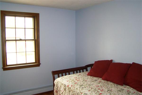 29 Holly Road Reading, MA 01867 - Photo 11 of 23 a bedroom with a bed and wooden floor