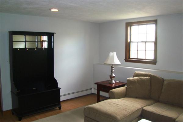 29 Holly Road Reading, MA 01867 - Photo 19 of 23 a living room with furniture and a window