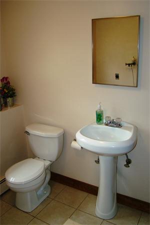 29 Holly Road Reading, MA 01867 - Photo 20 of 23 a bathroom with a toilet sink and mirror