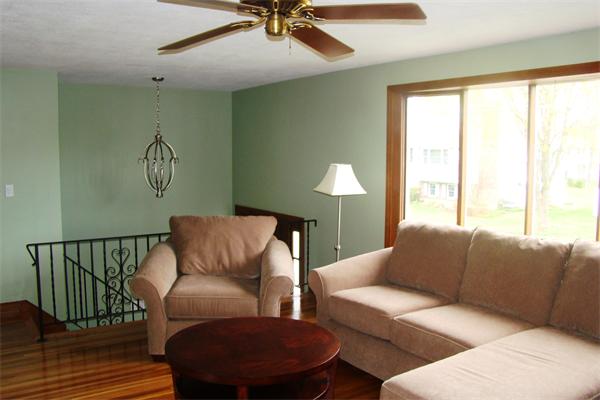 29 Holly Road Reading, MA 01867 - Photo 3 of 23 a living room with furniture and a window