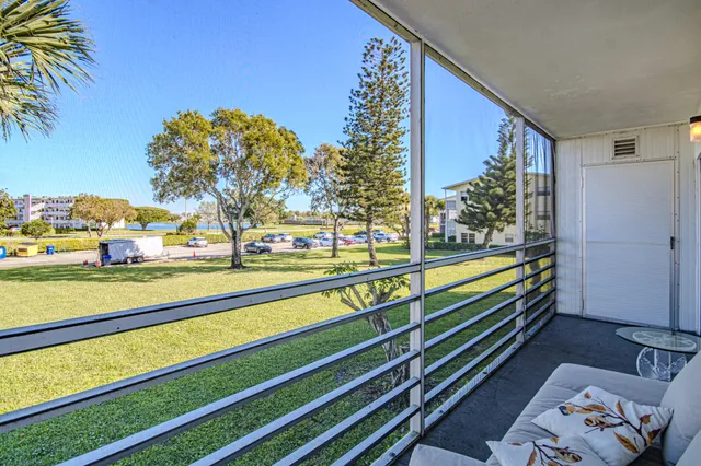 a view of a livingroom with furniture and window