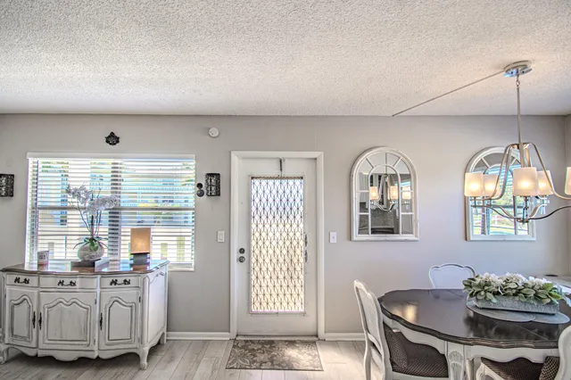 a view of a livingroom with furniture window and wooden floor