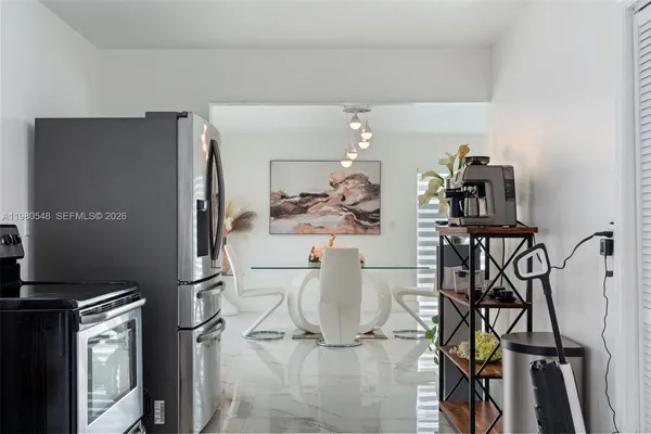 a view of a kitchen with appliances and cabinets