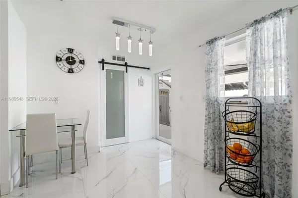 a view of dining room and cabinets
