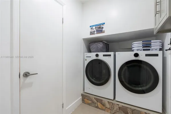 a utility room with dryer and washer