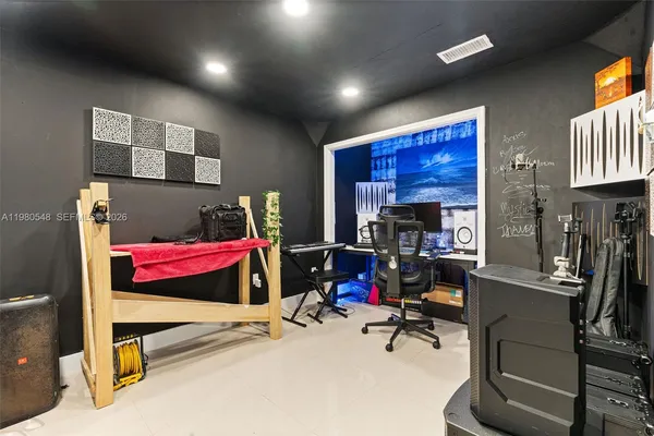 a living room with furniture gym equipment and a flat screen tv