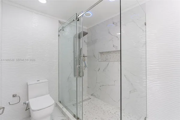 a bathroom with a shower and a toilet
