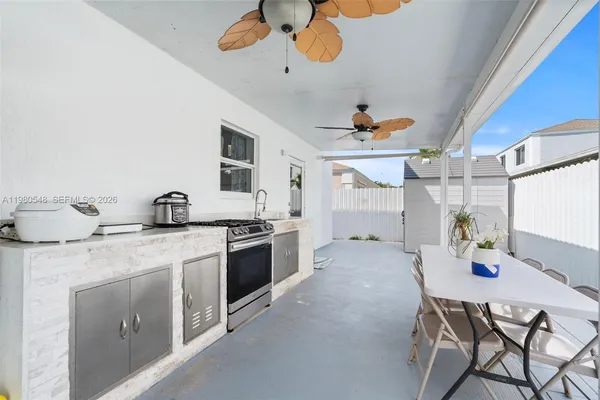 a kitchen with a table and chairs