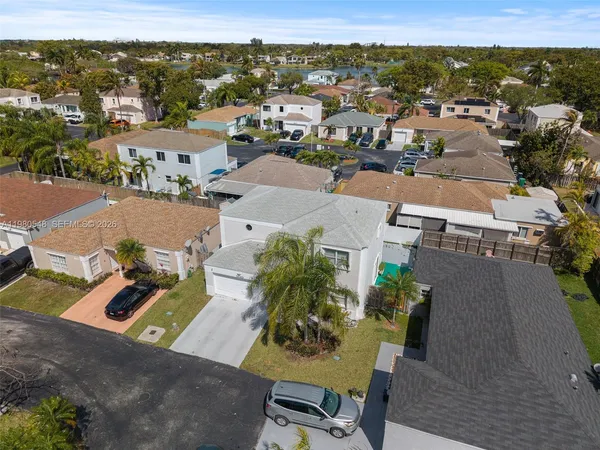 an aerial view of residential houses with outdoor space