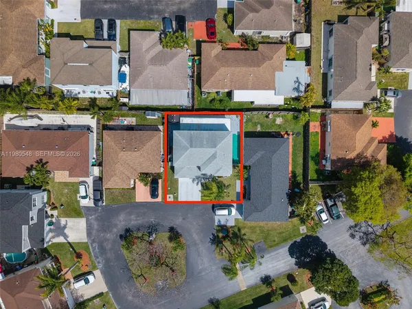 an aerial view of houses with outdoor space