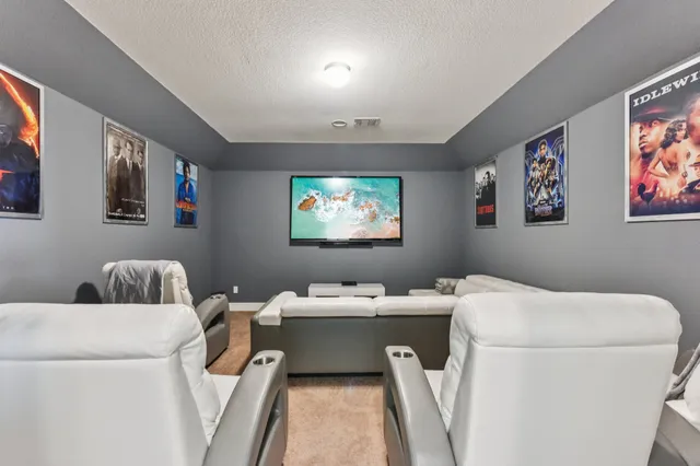 a bathroom with a sink and a painting on the wall