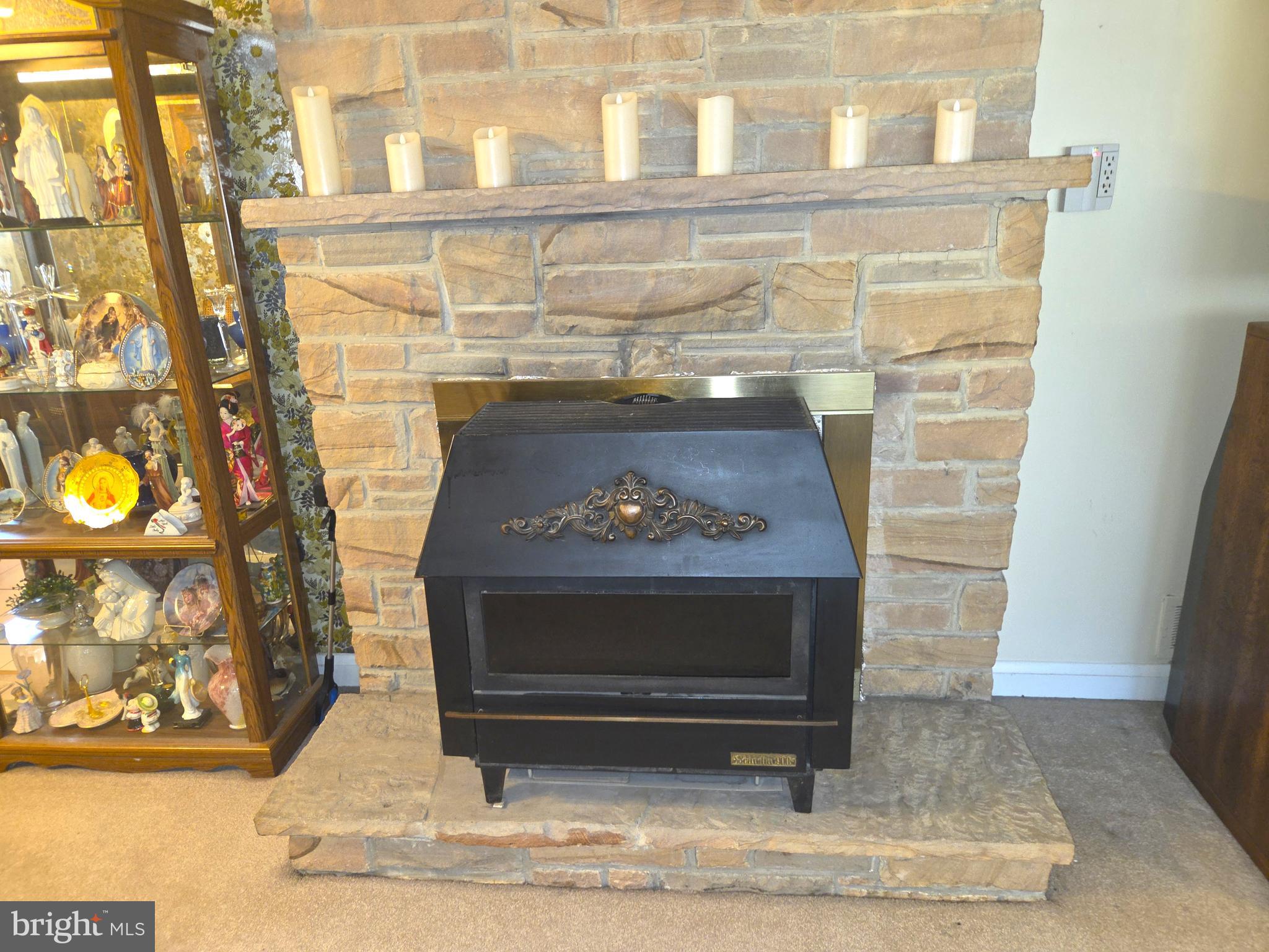 305 Bowleys Quarters Road Middle River, MD 21220 - Photo 26 of 55 a fireplace with a clock on wall