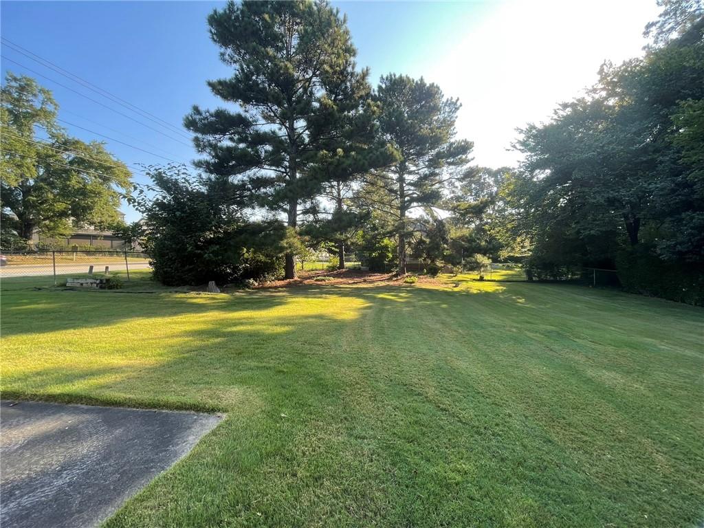 2297 Hylaea Road Tucker, GA 30084 - Photo 15 of 15 a view of yard with swimming pool and green space