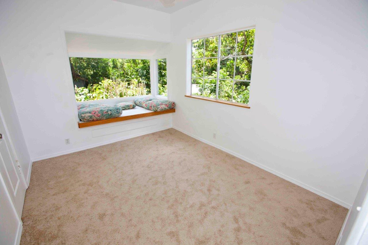 333 West Kuiaha Road Haiku, HI 96708 - Photo 4 of 21 an empty room with large windows and plants