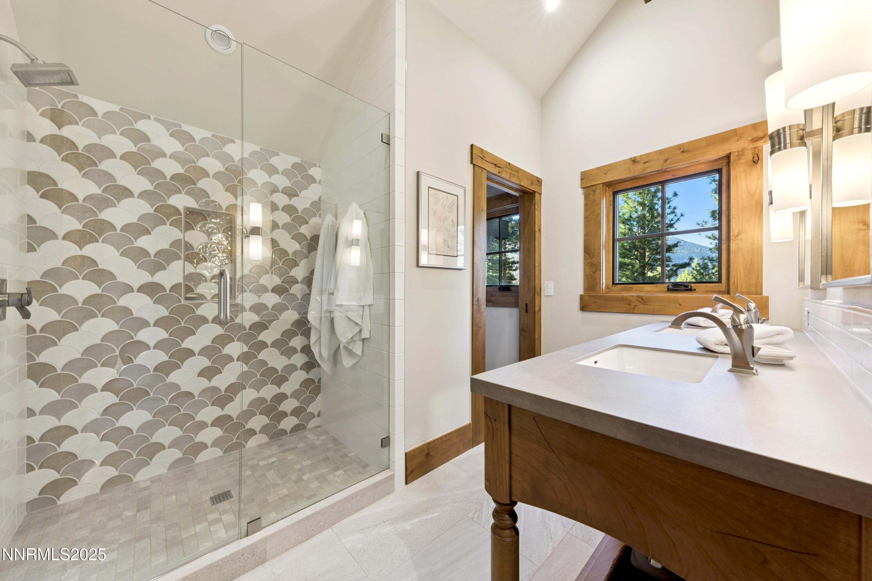 261 Redding Way Carson City, NV 89705 - Photo 48 of 90 a bathroom with a sink and a mirror