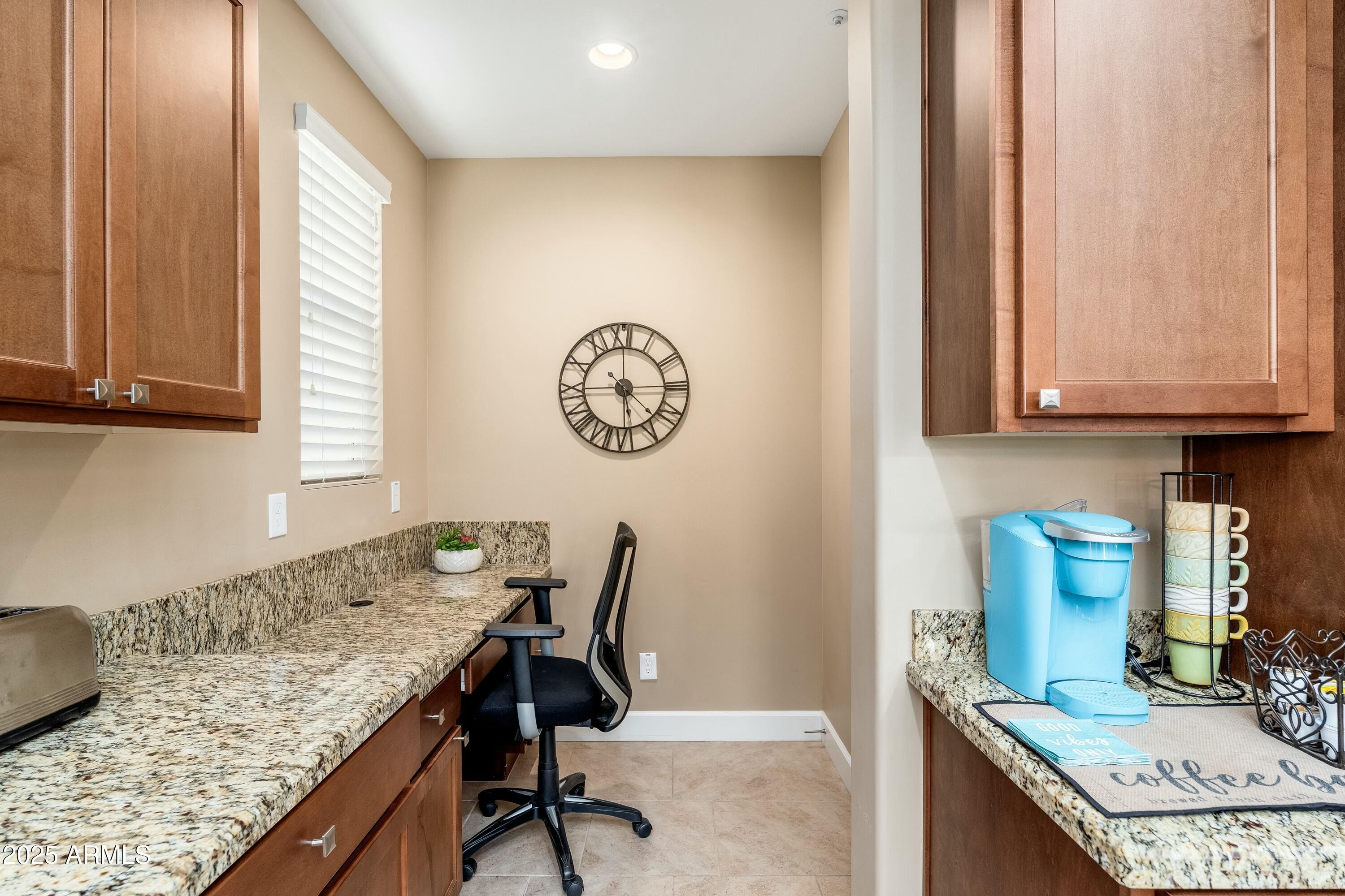 17972 East Silver Sage Lane Rio Verde, AZ 85263 - Photo 15 of 80 a view of a kitchen with granite countertop a sink a stove and a dining table