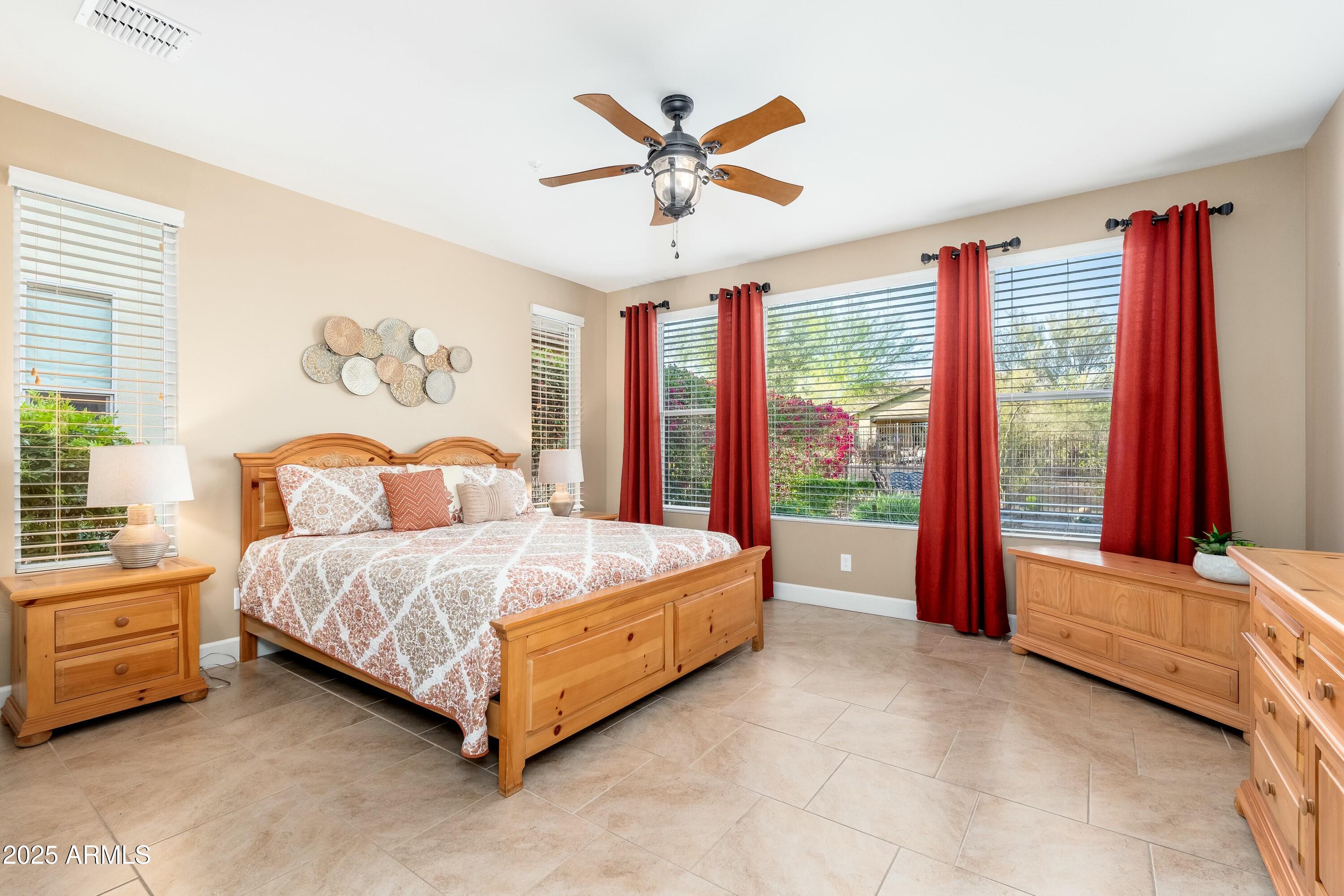 17972 East Silver Sage Lane Rio Verde, AZ 85263 - Photo 17 of 80 a bed sitting in a bedroom next to a window