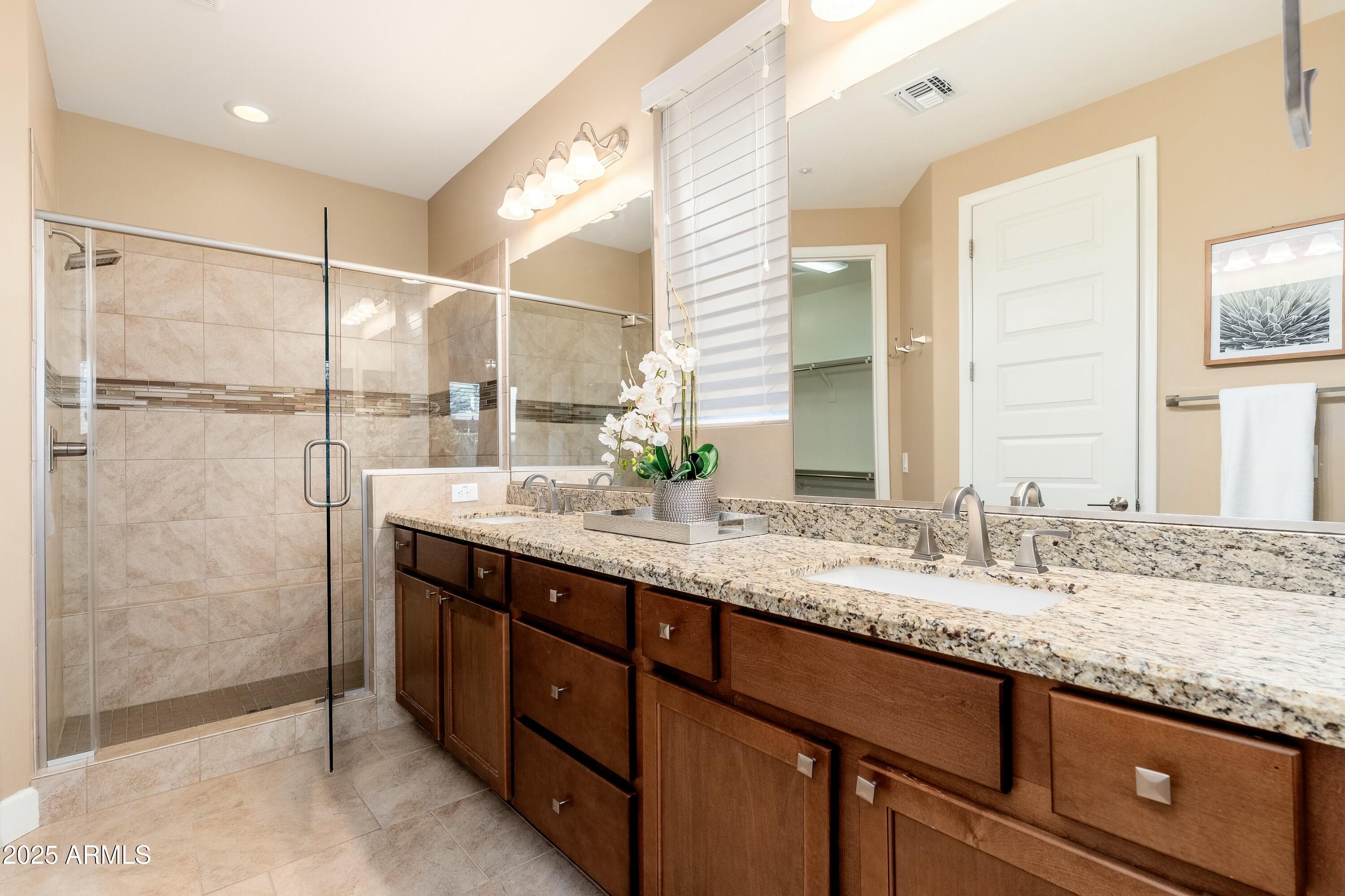 17972 East Silver Sage Lane Rio Verde, AZ 85263 - Photo 20 of 80 a bathroom with a granite countertop sink mirror and double