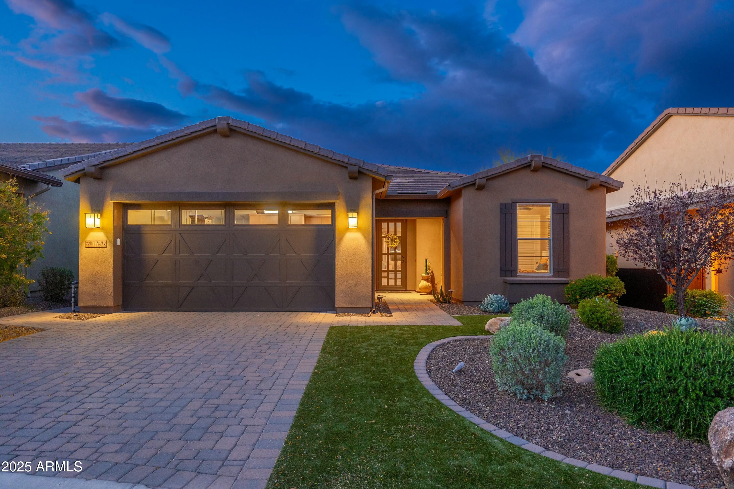 17972 East Silver Sage Lane Rio Verde, AZ 85263 - Photo 2 of 80 a front view of a house with a yard