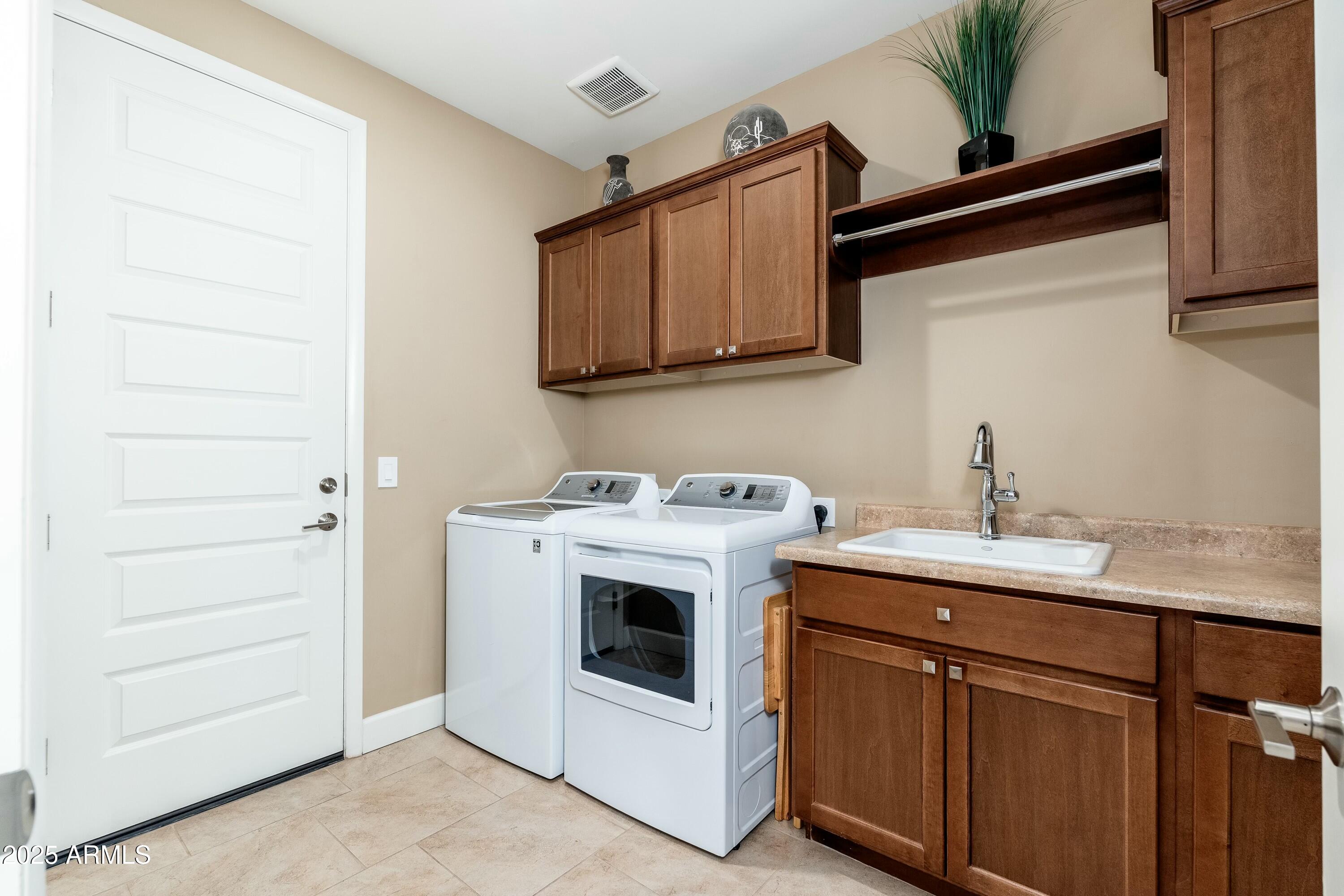 17972 East Silver Sage Lane Rio Verde, AZ 85263 - Photo 24 of 80 a utility room with sink dryer and washer