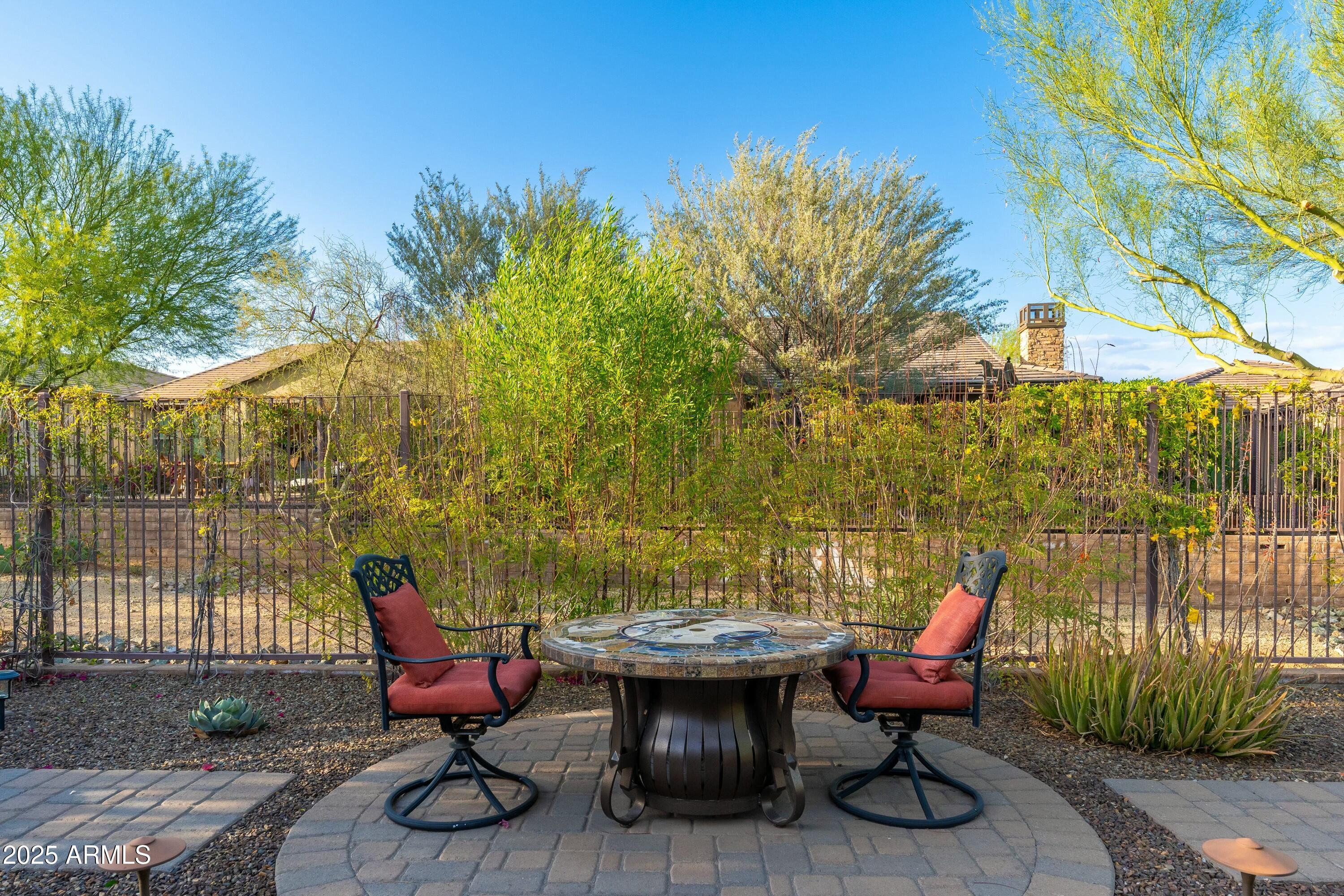 17972 East Silver Sage Lane Rio Verde, AZ 85263 - Photo 29 of 80 a view of a lounge chair in the back yard of the house