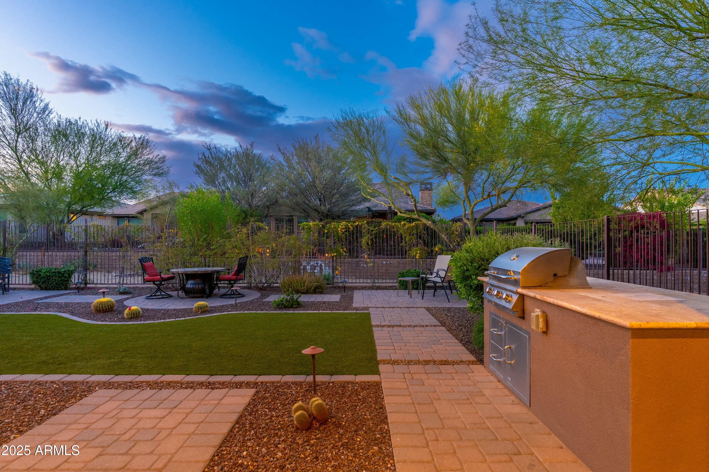 17972 East Silver Sage Lane Rio Verde, AZ 85263 - Photo 34 of 80 a view of a backyard with sitting area