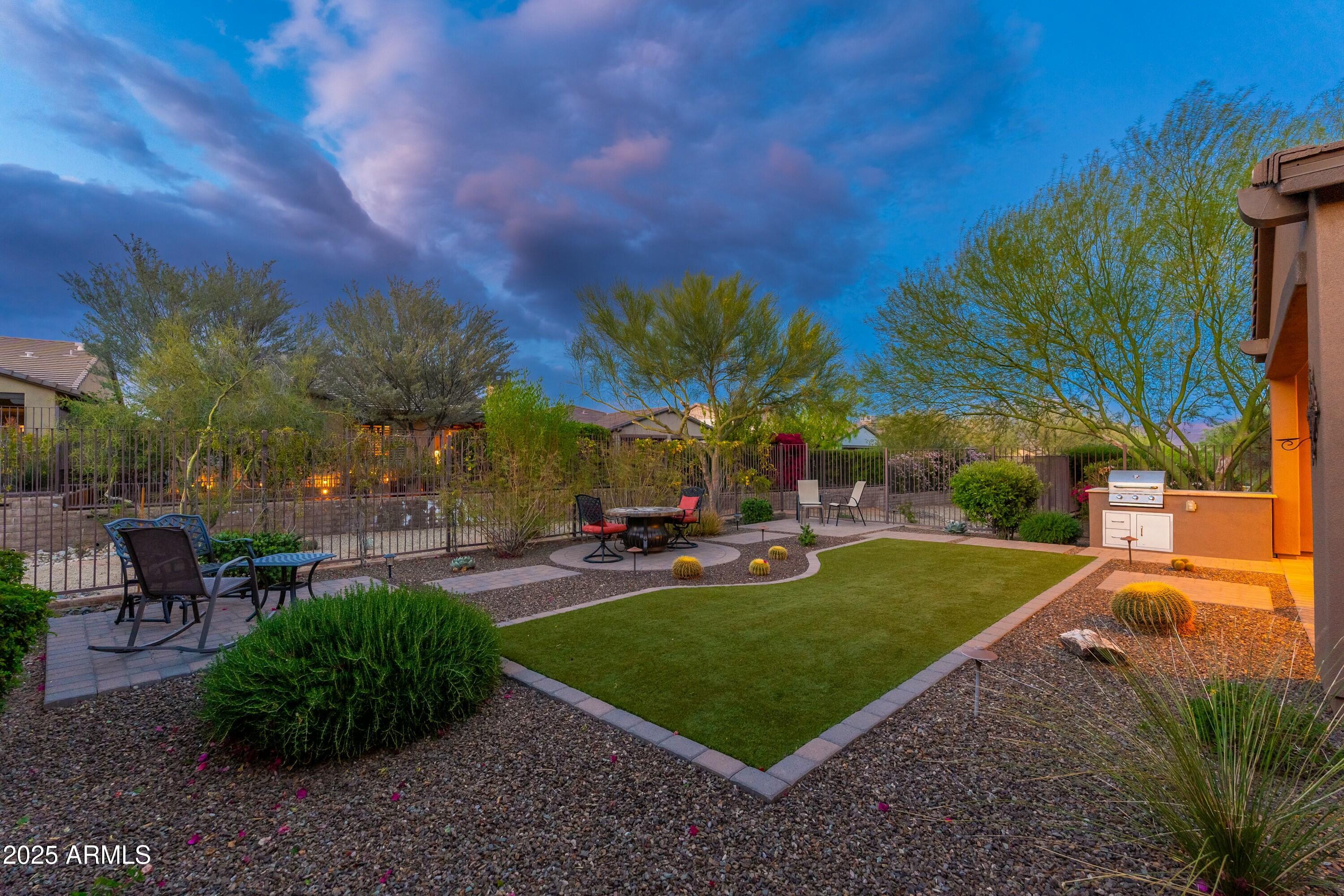 17972 East Silver Sage Lane Rio Verde, AZ 85263 - Photo 40 of 80 a view of a backyard with sitting area