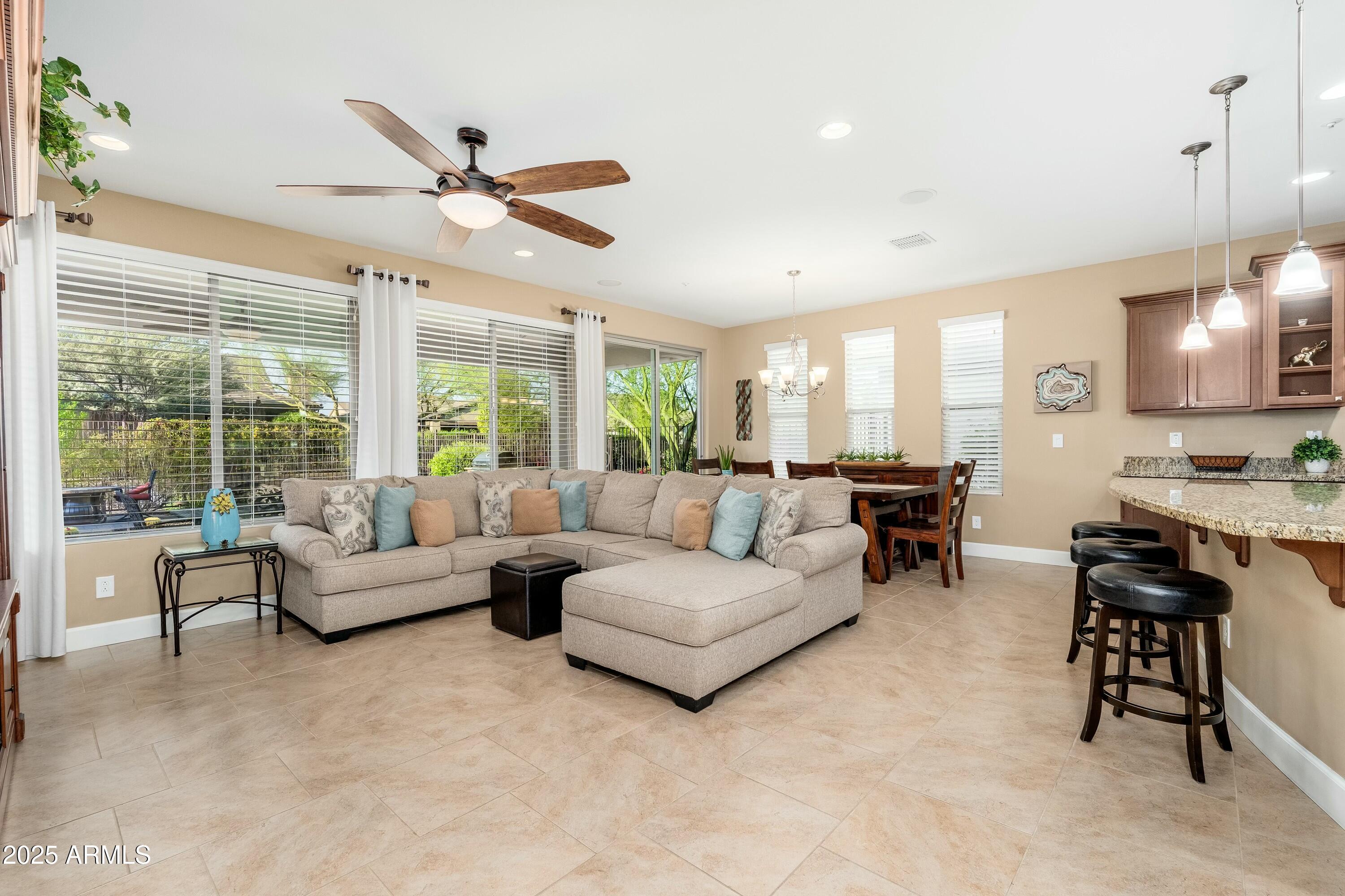 17972 East Silver Sage Lane Rio Verde, AZ 85263 - Photo 4 of 80 a living room with furniture and a large window