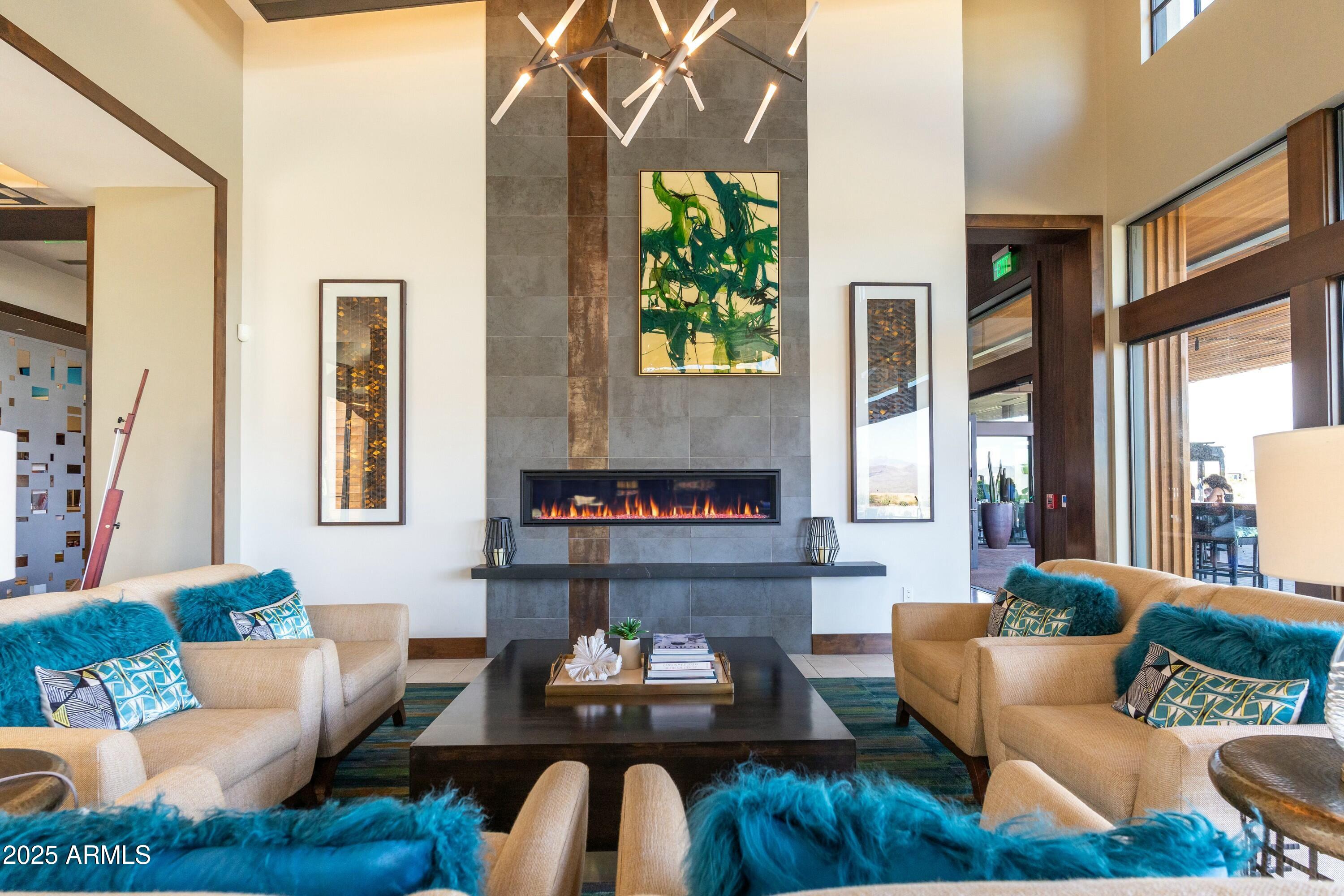 17972 East Silver Sage Lane Rio Verde, AZ 85263 - Photo 56 of 80 a living room with fireplace furniture and a large window