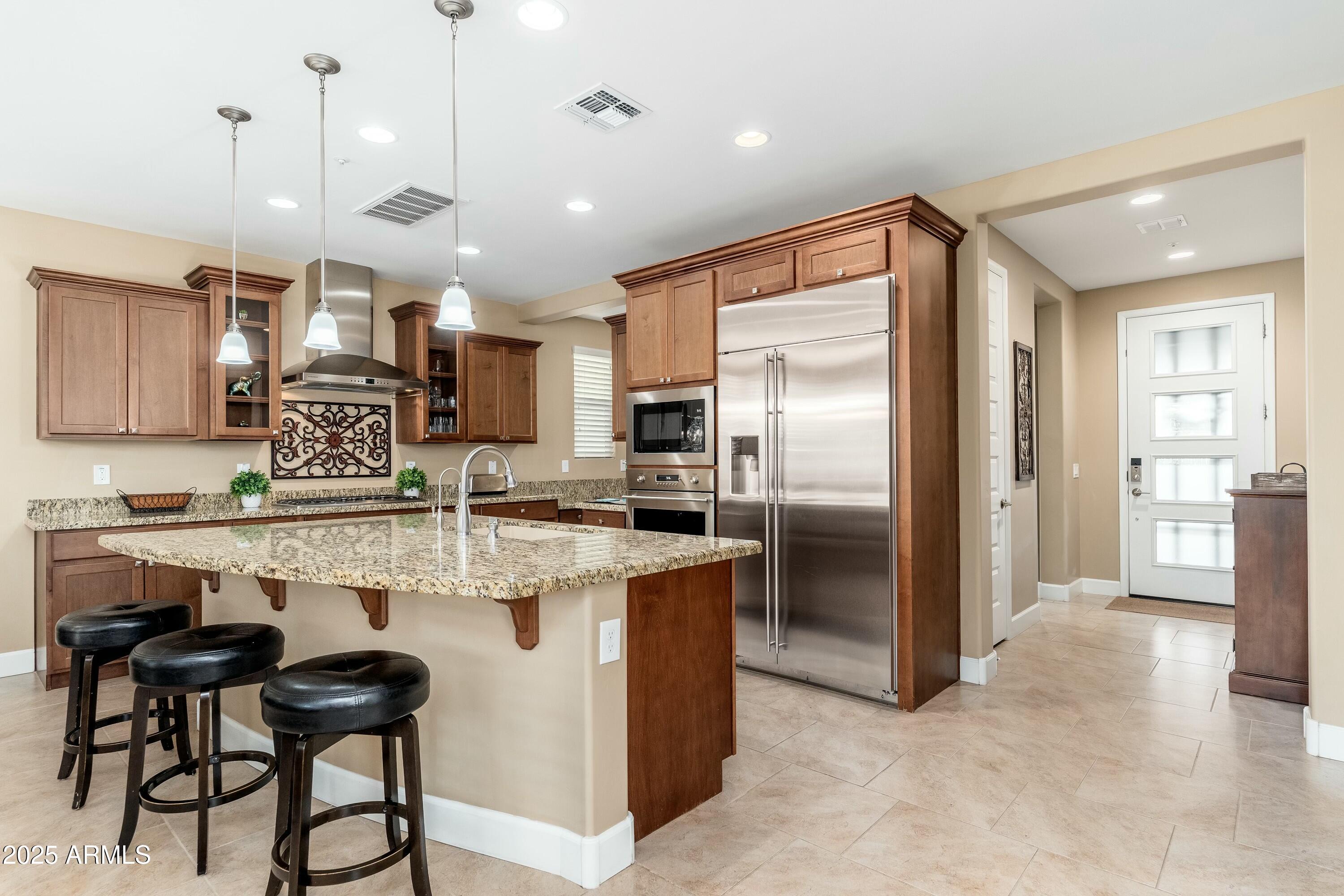 17972 East Silver Sage Lane Rio Verde, AZ 85263 - Photo 7 of 80 a kitchen with kitchen island a counter top space appliances and cabinets