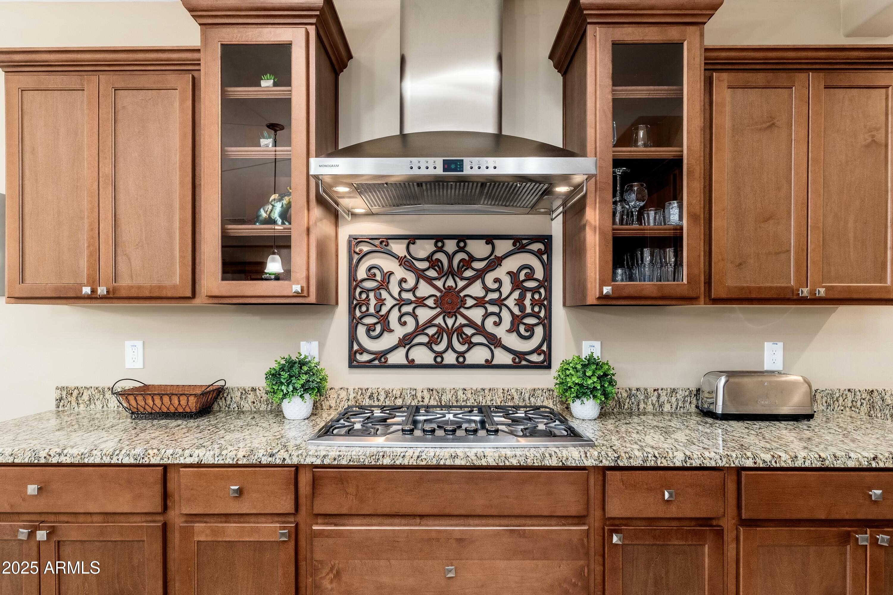 17972 East Silver Sage Lane Rio Verde, AZ 85263 - Photo 10 of 80 a kitchen with granite countertop a sink and a stove
