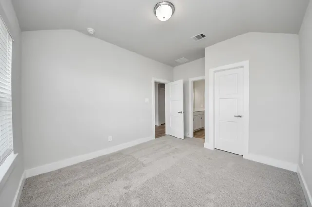 a bathroom with a sink vanity granite and a mirror