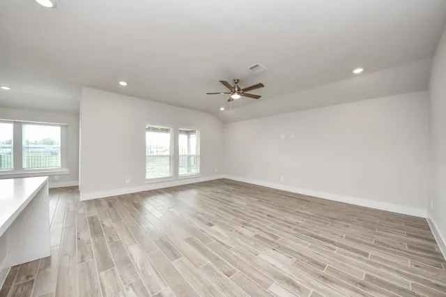 a view of kitchen with wooden floor and window