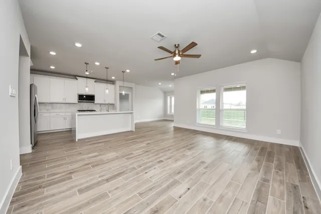a view of kitchen with wooden floor and window
