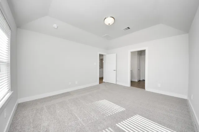 a bathroom with a double vanity sink and mirror
