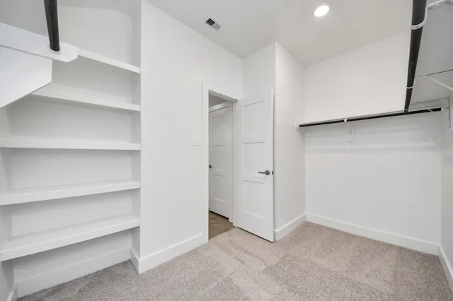 a bathroom with a double vanity sink a mirror and a shower