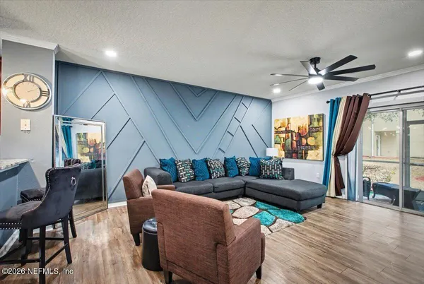 a living room with furniture fireplace and a flat screen tv