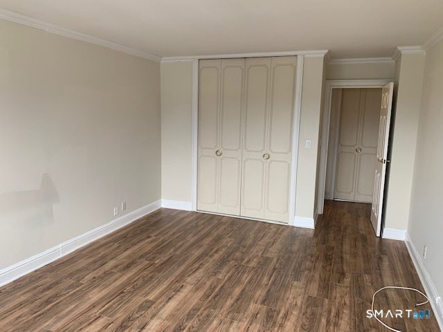 50 Glenbrook Road, Unit 5G Stamford, CT 06902 - Photo 30 of 40 a view of an empty room and wooden floor