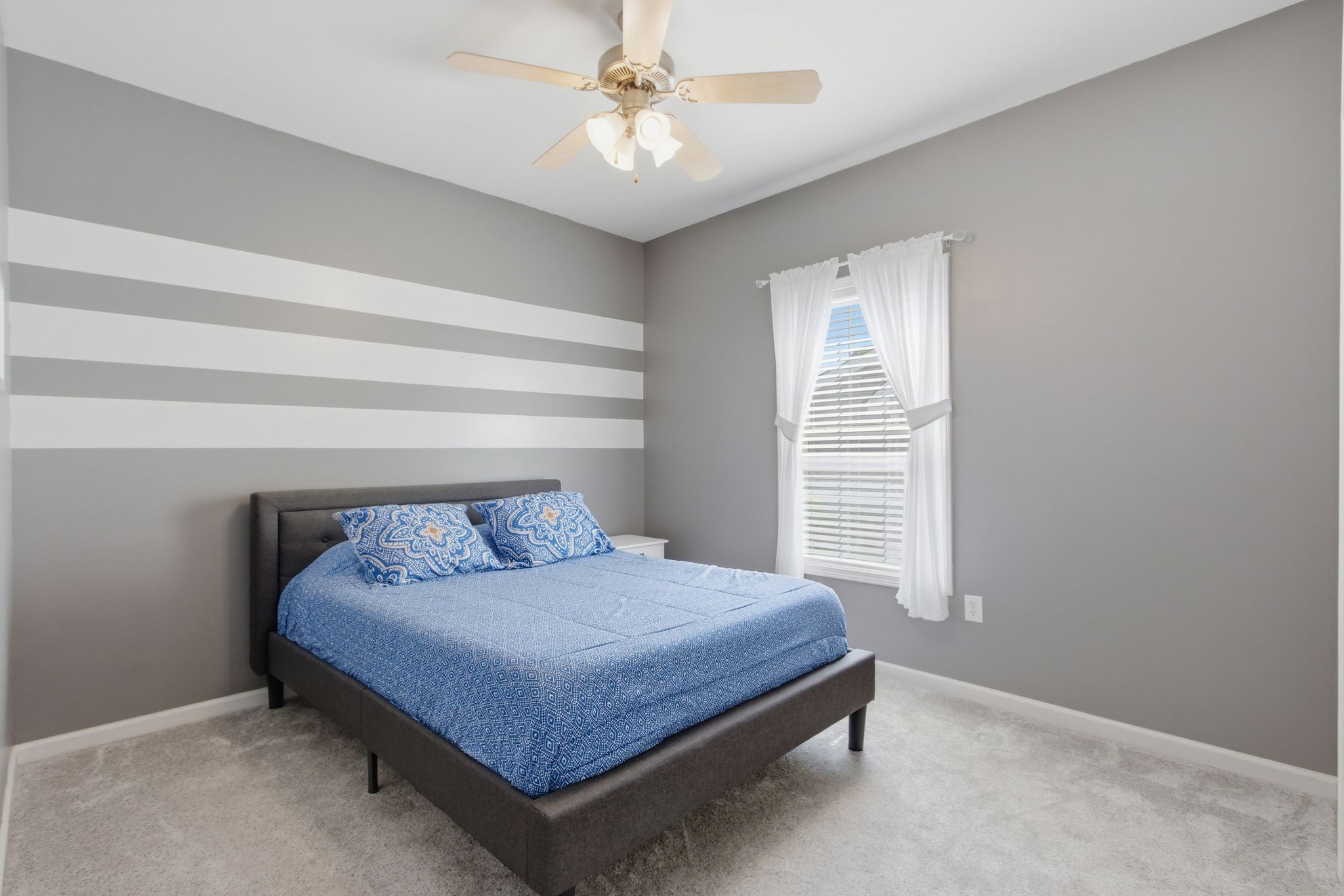 1503 Chapman Lane Spring Hill, TN 37174 - Photo 20 of 33 a bedroom with a bed and a chandelier