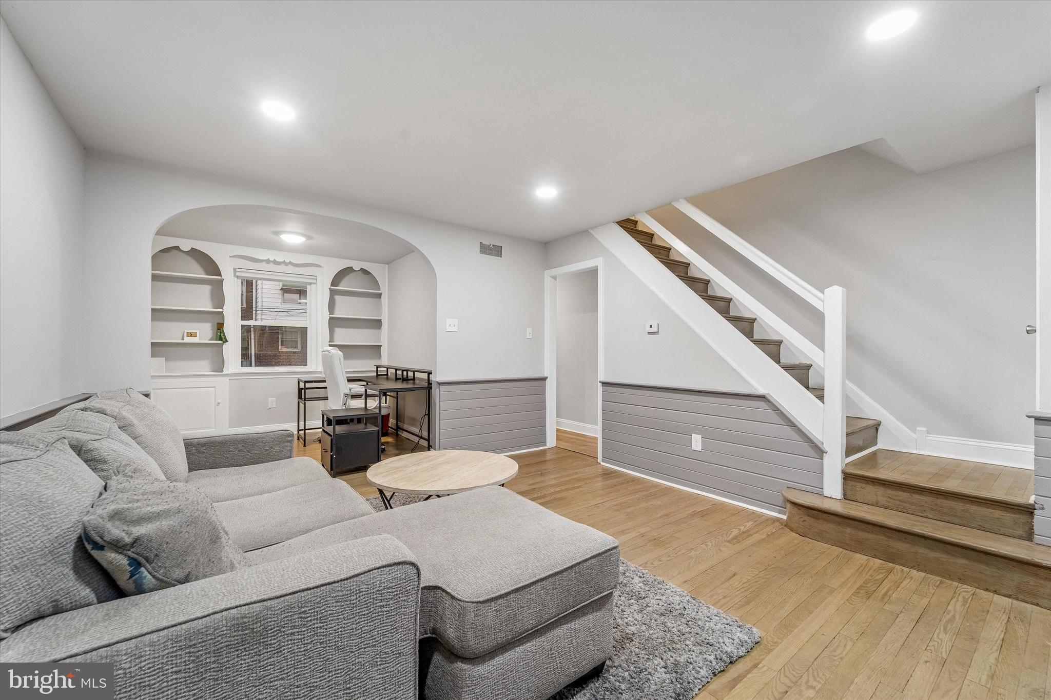 332 Springton Road Upper Darby, PA 19082 - Photo 5 of 15 a living room with furniture and a large window