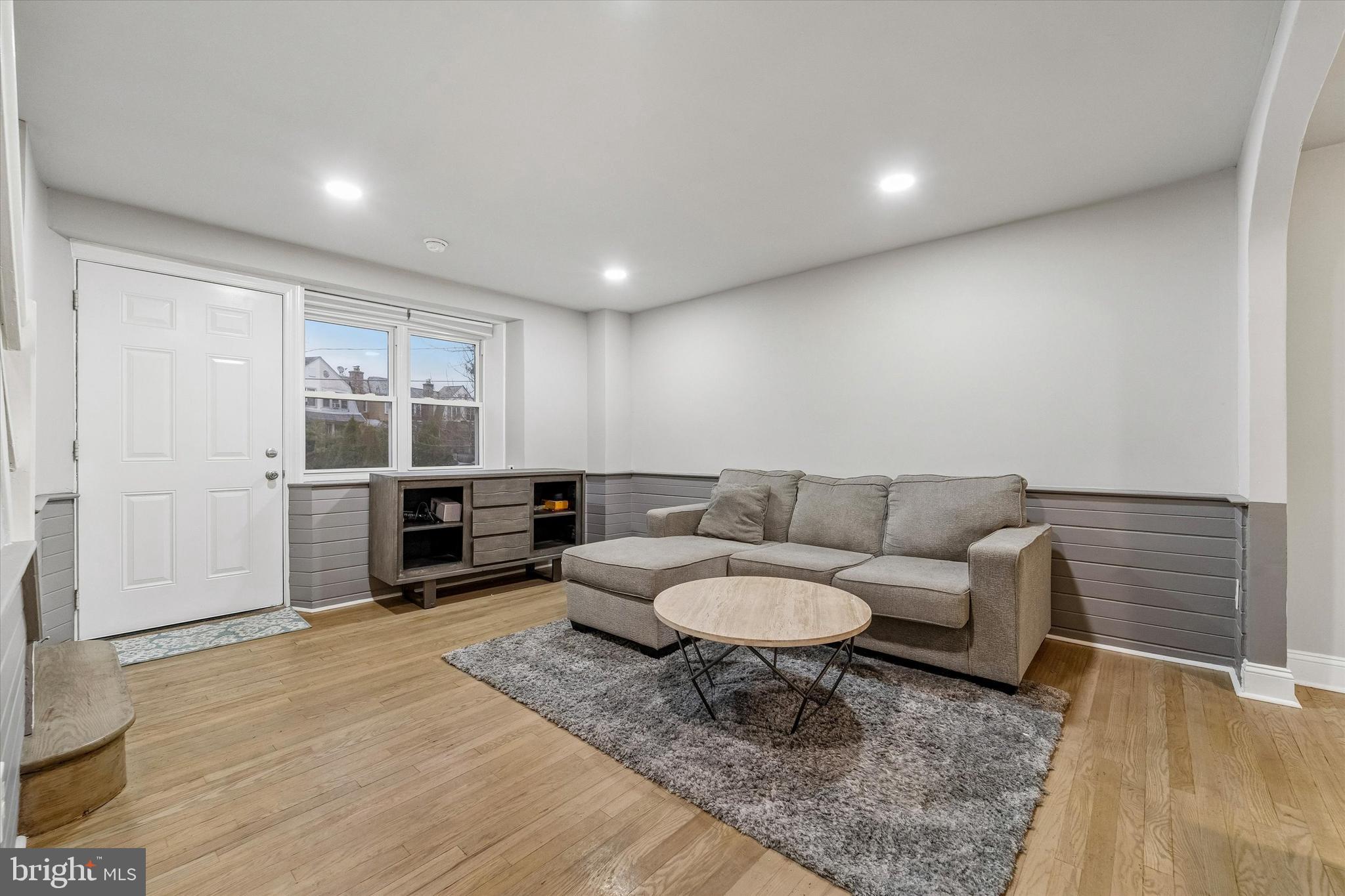 332 Springton Road Upper Darby, PA 19082 - Photo 6 of 15 a living room with furniture and a rug