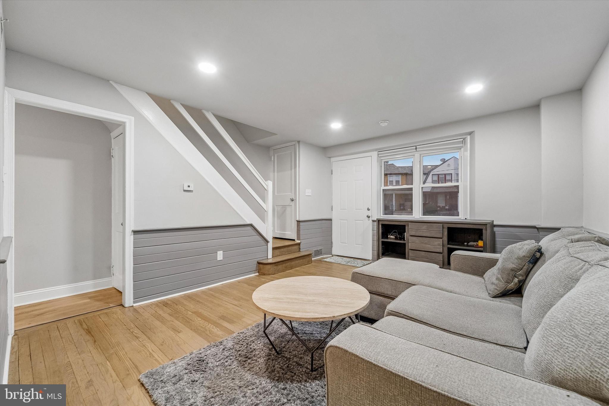 332 Springton Road Upper Darby, PA 19082 - Photo 7 of 15 a living room with furniture and wooden floor